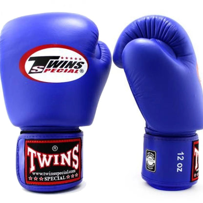 Blue boxing gloves with Twins Special logo on a white background