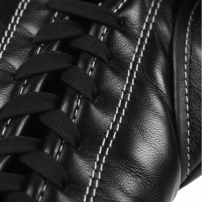 Pair of black boxing gloves with Kuguan branding on a white background