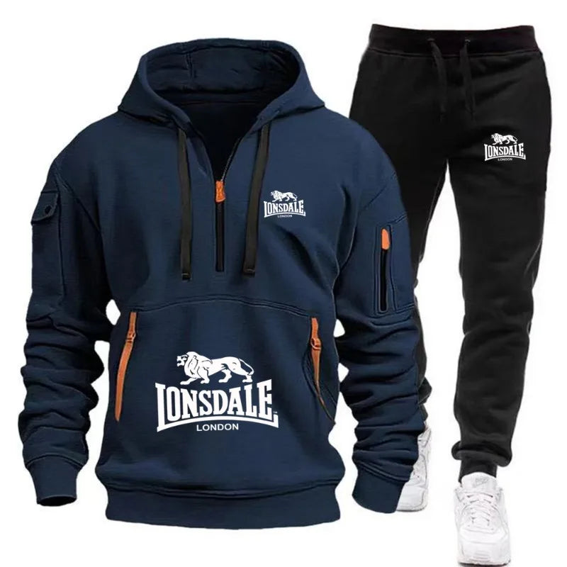 Navy hoodie and black pants with Lonsdale logo on a white background