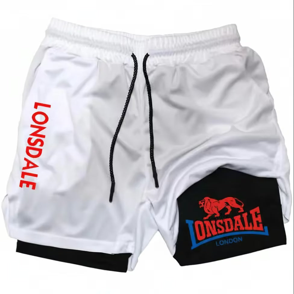 White athletic shorts with black drawstrings, featuring a red 'LONSDALE' logo on the left leg and a black patch on the right leg with a red lion logo and 'LONSDALE LONDON' text.