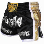 FitZone360 black Muay Thai training shorts with white lettering and gold side panel details