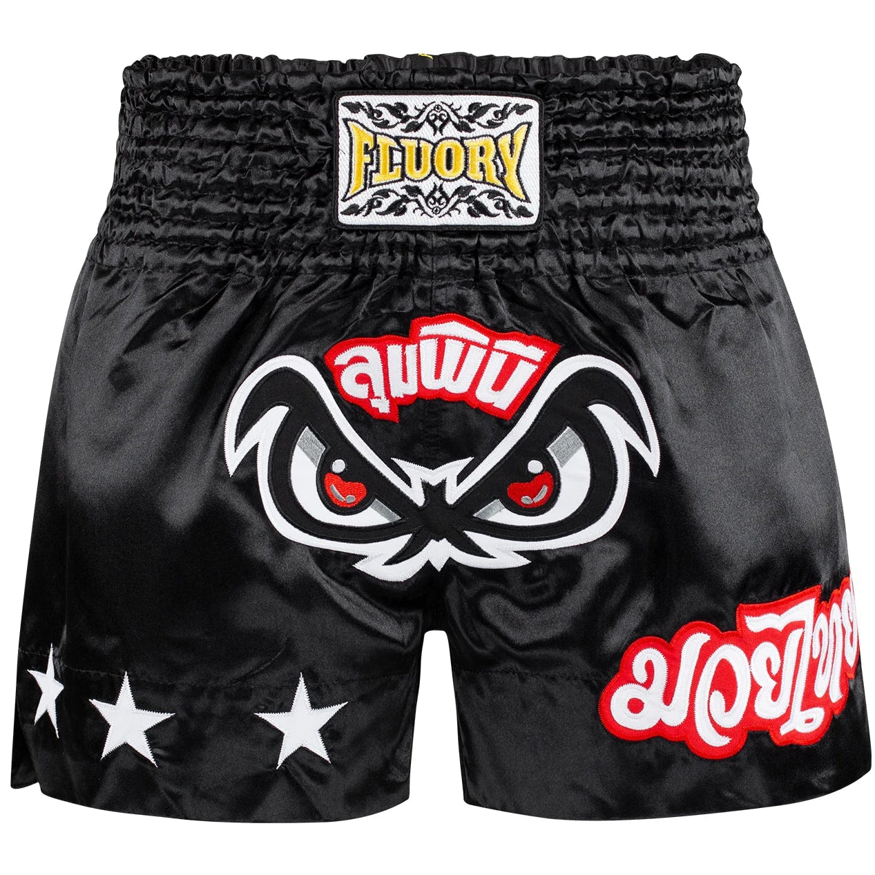 Black Muay Thai shorts with a fierce face design and 'Fluory' branding on a white background.