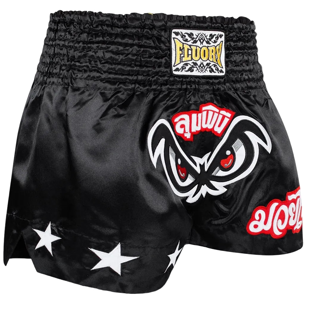 Black boxing shorts with red and white designs on a gray background, featuring the Fluory brand.