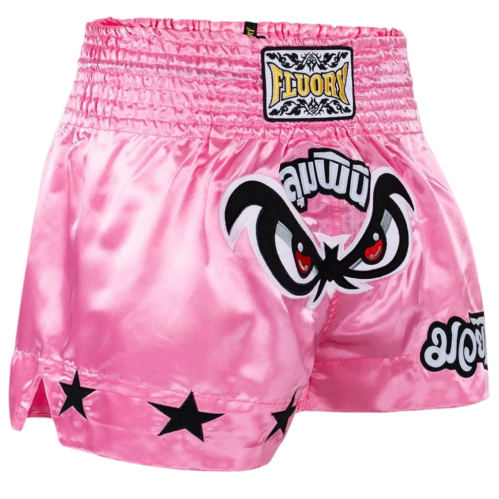 Pink boxing shorts with black star designs and 'FLUORY' branding on a gray background.