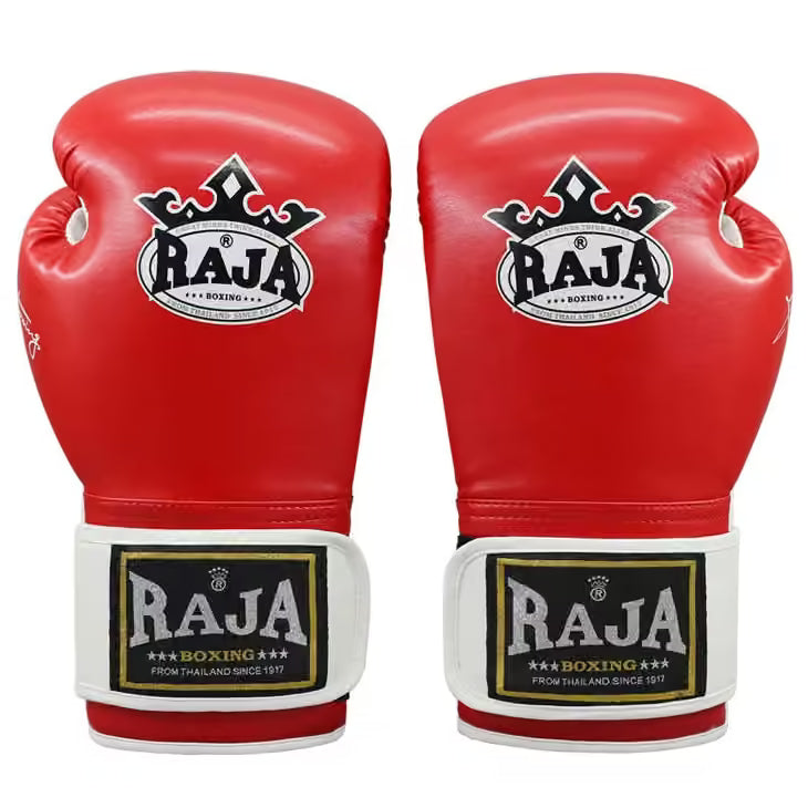 A pair of red boxing gloves with white and black wrist straps, featuring the 'Raja Boxing' logo on the front, set against a plain white background.