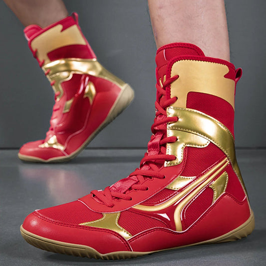 Red and gold high-top sneakers on a gray background