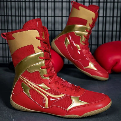 Red and gold boxing shoes with a black background