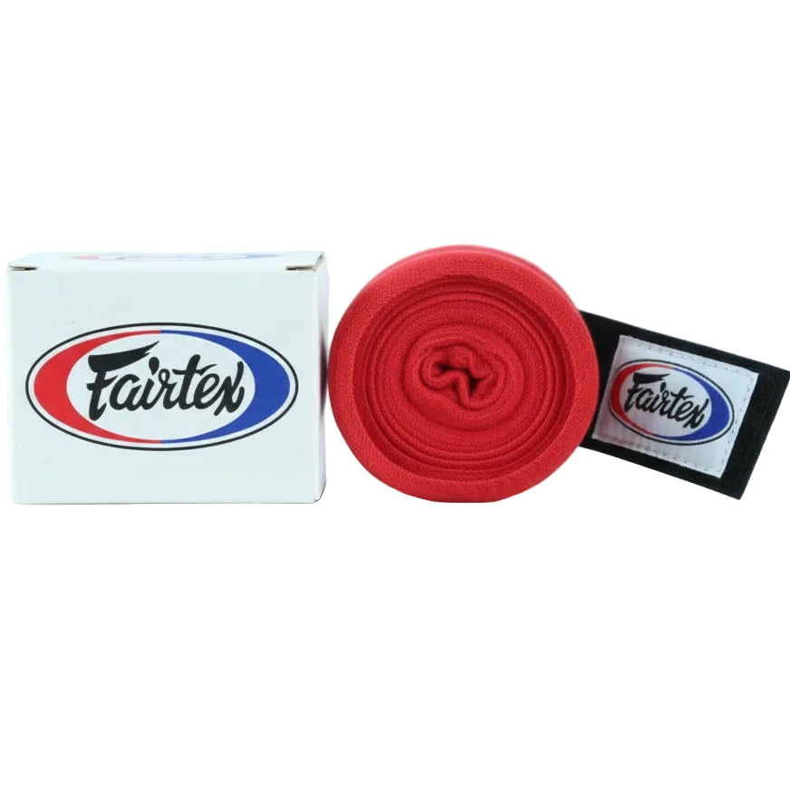 Red boxing bandage with Fairtex logo next to a white box and black strap on a light blue background