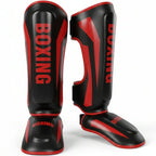 Black and red boxing shin guards on a white background