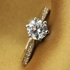 Diamond ring on a brown fabric background