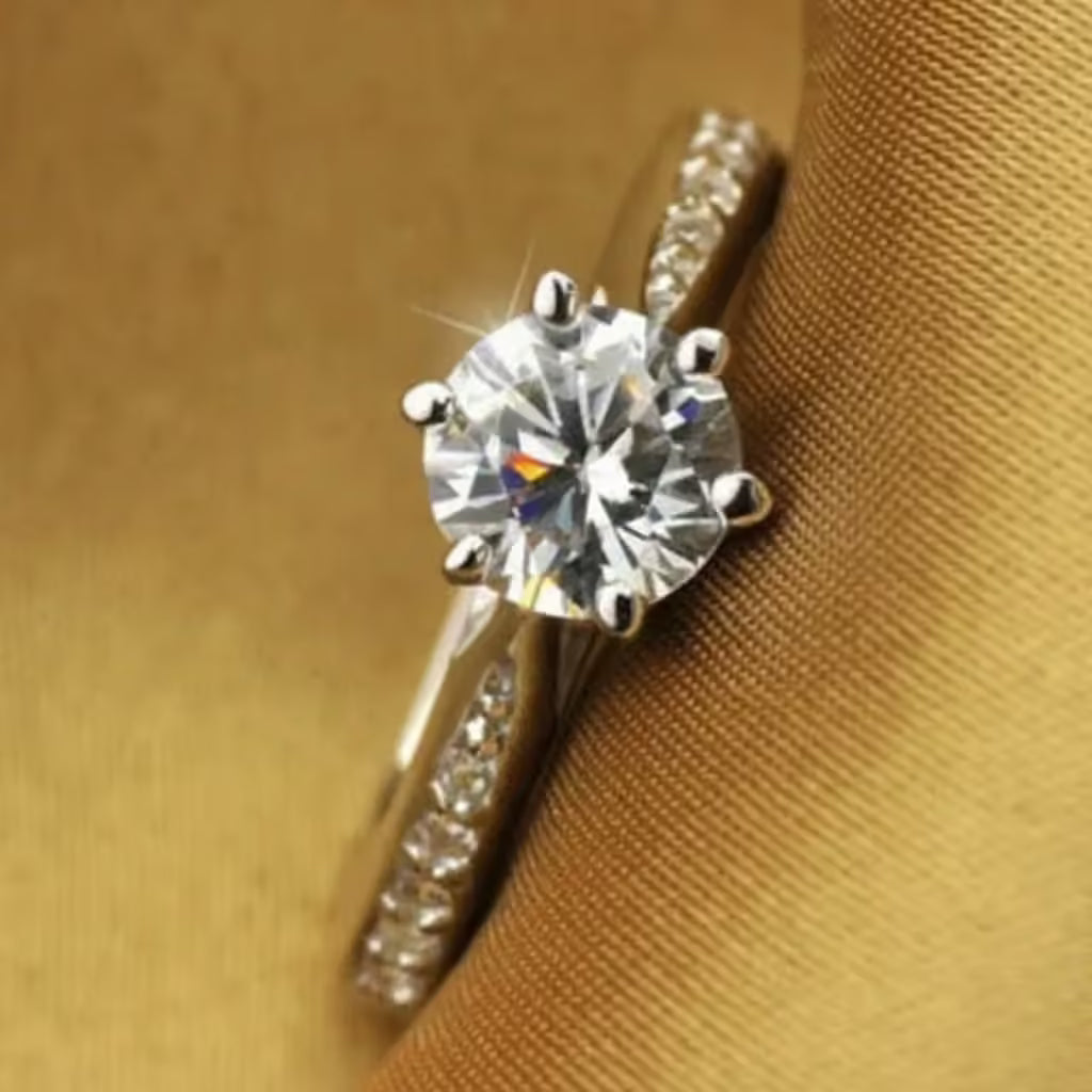 Diamond ring on a brown fabric background