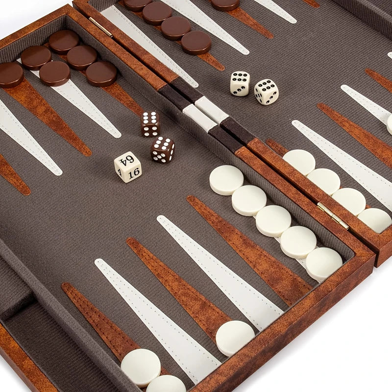 Backgammon set with pieces and dice on a brown board