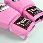 Pink boxing gloves with Twin Special logo on a white background