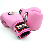 Pink boxing gloves with Twins Special branding on a white background