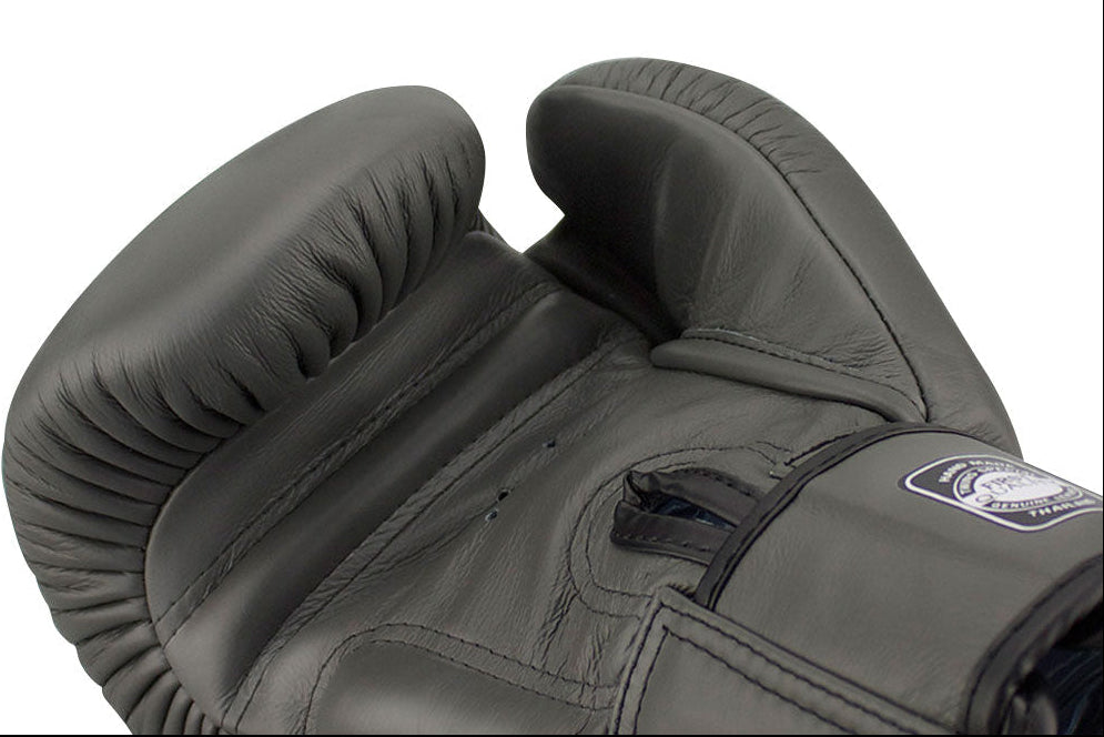 Gray boxing gloves with a brand logo on a white background