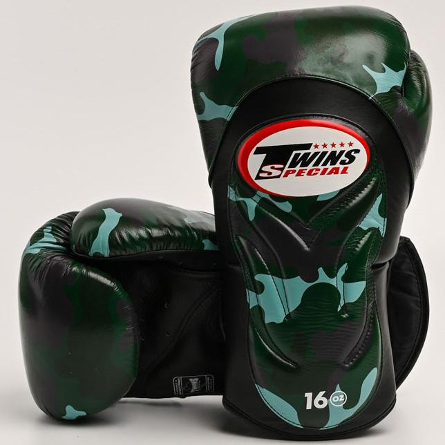 Pair of black and green camouflage boxing gloves with Twins Special logo on a light gray background