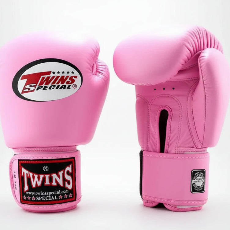 Pink boxing gloves with Twins Special branding on a white background