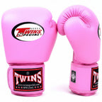 Pink boxing gloves with Twins Special logo on a white background