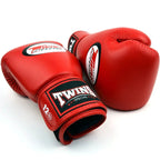 Red boxing gloves with Twins Special logo on a white background