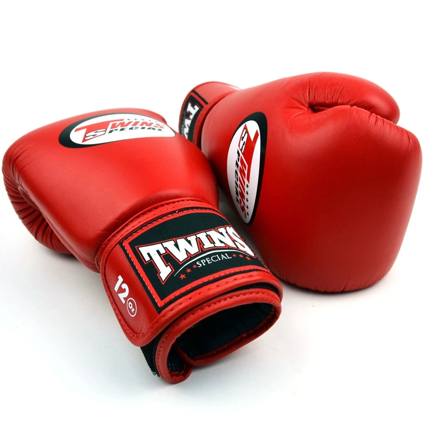 Red boxing gloves with Twins Special logo on a white background