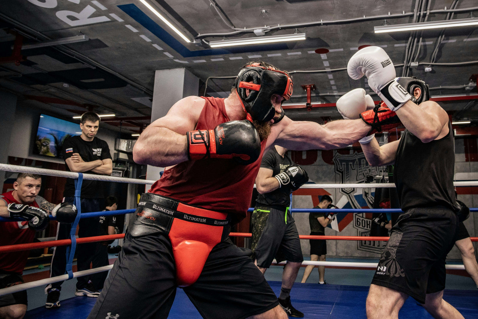 two boxers sparring wearing boxing gear fitzone360