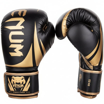 Black and gold boxing gloves with Venum branding on a white background