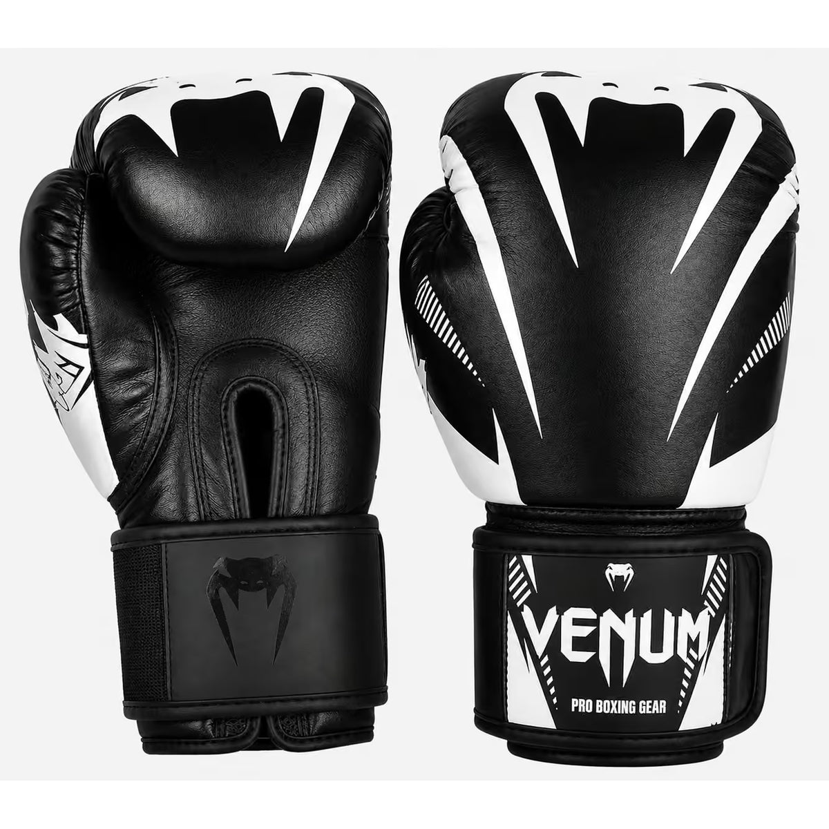 A pair of black and white Venum boxing gloves shown against a light gray background, displaying both the front and back views.