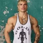 Man wearing a white tank top with 'Gold's Gym' logo against a textured green background